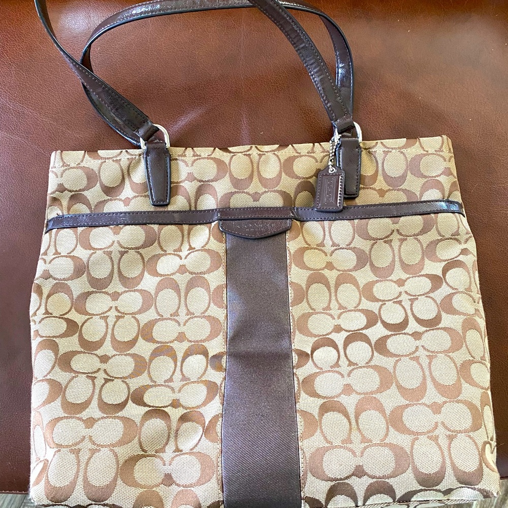 Coach Brown/Tan tote bag with signature canvas and stripe.